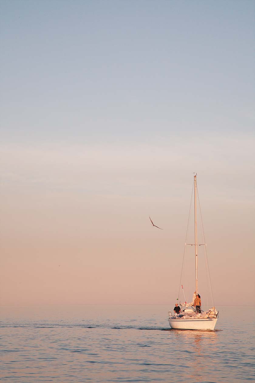 Boat in haze pastel sunset